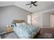 Bedroom featuring a ceiling fan and a bed with a blue patterned comforter at 1045 Fairway Ridge Nw Rd, Concord, NC 28027