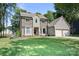 Charming two-story home featuring brick and siding, large bay windows, and a manicured front lawn at 1045 Fairway Ridge Nw Rd, Concord, NC 28027