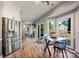 Bright kitchen and breakfast nook with wood floors and stainless steel appliances at 1045 Fairway Ridge Nw Rd, Concord, NC 28027