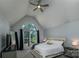 Primary bedroom with large arched window and light gray walls at 110 Club Dr, Mooresville, NC 28115
