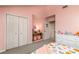 Bright bedroom featuring ample closet space, neutral walls, and plush carpeting at 110 Club Dr, Mooresville, NC 28115