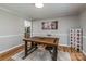 Dining room with wooden table and seating, wood laminate flooring, with neutral paint at 110 Club Dr, Mooresville, NC 28115