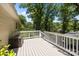 Spacious back deck offering a perfect spot for outdoor dining and relaxation, with lush greenery surrounding at 11329 Torino Rd, Matthews, NC 28105