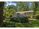 Spacious back deck surrounded by lush greenery, offering a tranquil outdoor space at 11329 Torino Rd, Matthews, NC 28105