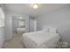 Bright bedroom featuring neutral walls, carpeting, and a mirrored closet, offering a serene living space at 11329 Torino Rd, Matthews, NC 28105