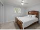 Bedroom featuring a classic wooden bed frame and a ceiling fan, offering a comfortable and inviting space at 11329 Torino Rd, Matthews, NC 28105
