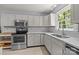 Bright kitchen with stainless steel appliances, quartz countertops, and plenty of storage at 11329 Torino Rd, Matthews, NC 28105