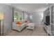 Airy living room with natural light, a comfortable sofa, and stylish decor for relaxation at 11329 Torino Rd, Matthews, NC 28105