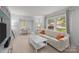 Bright living room featuring a large window and connecting dining area, perfect for entertaining at 11329 Torino Rd, Matthews, NC 28105