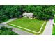 Aerial shot of a home with a large green lawn, surrounded by mature trees at 121 Pelham Ln, Fort Mill, SC 29715