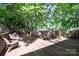 Inviting outdoor deck with wood furniture and lush green trees providing shade at 121 Pelham Ln, Fort Mill, SC 29715