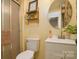Cozy bathroom with a walk-in shower, vanity, and round mirror at 121 Pelham Ln, Fort Mill, SC 29715