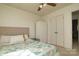 Well-lit bedroom featuring a ceiling fan, white walls, and a closet at 121 Pelham Ln, Fort Mill, SC 29715