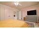 Bedroom with a ceiling fan, large dresser, and two closets at 121 Pelham Ln, Fort Mill, SC 29715