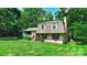 Charming home featuring a brick exterior, well-manicured lawn, and mature trees at 121 Pelham Ln, Fort Mill, SC 29715