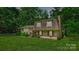 Charming home featuring a brick exterior, well-manicured lawn, and mature trees at 121 Pelham Ln, Fort Mill, SC 29715