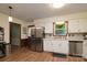 Classic kitchen features white cabinetry and stainless steel appliances at 121 Pelham Ln, Fort Mill, SC 29715