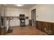 Bright kitchen with wood floors, white cabinets, and stainless steel appliances at 121 Pelham Ln, Fort Mill, SC 29715