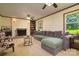 Cozy living room with a brick fireplace and large windows with views of the yard at 121 Pelham Ln, Fort Mill, SC 29715