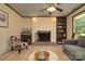 Relaxing living room with fireplace, seating and natural light at 121 Pelham Ln, Fort Mill, SC 29715