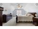 Charming bedroom featuring vaulted ceilings, warm lighting, and elegant furniture at 129 Nims Spring Dr, Fort Mill, SC 29715