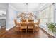 Elegant dining room featuring hardwood floors, decorative molding and a stylish chandelier at 129 Nims Spring Dr, Fort Mill, SC 29715
