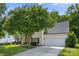 Traditional home with a well-manicured lawn and a two-car garage at 129 Nims Spring Dr, Fort Mill, SC 29715