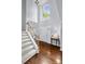 Grand foyer showcasing hardwood floors, a staircase and a large window for natural light at 129 Nims Spring Dr, Fort Mill, SC 29715