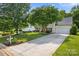 Charming home with well-manicured front yard, mature trees, and a long driveway at 129 Nims Spring Dr, Fort Mill, SC 29715