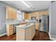Beautiful kitchen with granite countertops, stainless steel appliances, and an island at 129 Nims Spring Dr, Fort Mill, SC 29715