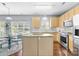 Kitchen and eat-in area with stainless steel appliances, an island, and natural light at 129 Nims Spring Dr, Fort Mill, SC 29715
