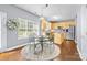 Eat-in kitchen featuring stainless steel appliances, island, and natural light at 129 Nims Spring Dr, Fort Mill, SC 29715
