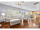 Living room flowing into eat-in kitchen and featuring hardwood floors, neutral color palette, and fireplace at 129 Nims Spring Dr, Fort Mill, SC 29715