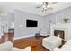 Bright living room with hardwood flooring, fireplace, and a view to entry at 129 Nims Spring Dr, Fort Mill, SC 29715