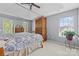 Spacious main bedroom with tray ceiling features a large bed and ample natural light at 129 Nims Spring Dr, Fort Mill, SC 29715