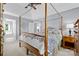 Comfortable main bedroom showcases a canopy bed and view of the attached bathroom at 129 Nims Spring Dr, Fort Mill, SC 29715
