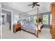 Inviting main bedroom features a canopy bed and views of the walk-in closet at 129 Nims Spring Dr, Fort Mill, SC 29715