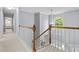 Bright upstairs hallway with natural light showcases a large arched window at 129 Nims Spring Dr, Fort Mill, SC 29715