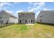 This home features a spacious backyard with a concrete patio, perfect for outdoor entertaining at 12912 Canterbury Castle Dr, Charlotte, NC 28273