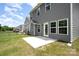A lovely fenced backyard featuring a concrete patio, gray siding, and manicured lawn at 12912 Canterbury Castle Dr, Charlotte, NC 28273