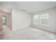 Bright bedroom with carpeted floor and two windows providing natural light, creating a cozy atmosphere at 12912 Canterbury Castle Dr, Charlotte, NC 28273
