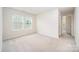 Bright bedroom with carpeted floor and two windows providing natural light, creating a cozy atmosphere at 12912 Canterbury Castle Dr, Charlotte, NC 28273