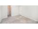 Bedroom featuring carpeted floor and a door to the closet at 12912 Canterbury Castle Dr, Charlotte, NC 28273