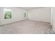 Bedroom with carpet, two windows and neutral walls at 12912 Canterbury Castle Dr, Charlotte, NC 28273