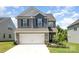 Two-story home with a two-car garage and landscaping at 12912 Canterbury Castle Dr, Charlotte, NC 28273