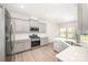 Modern kitchen with stainless steel appliances and light gray cabinets at 12912 Canterbury Castle Dr, Charlotte, NC 28273
