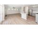 Open-concept living room and kitchen featuring modern design at 12912 Canterbury Castle Dr, Charlotte, NC 28273