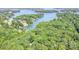 Stunning aerial view of the lake, showcasing the waterfront homes nestled among lush greenery and pristine blue waters at 140 Rustic Way Ln, Mooresville, NC 28117