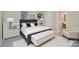 Cozy bedroom boasts a stylish bed, a plush rug, modern decor, and an ensuite bathroom, providing comfort and elegance at 140 Rustic Way Ln, Mooresville, NC 28117
