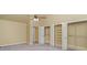 Bedroom featuring closets with mirrored doors and overhead shelving at 140 Rustic Way Ln, Mooresville, NC 28117